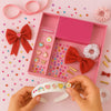 DIY Hair Drama Box with 2 Hair Bands, 1 Scrunchie, 1 Hair Bow, 11 Exclusive Charms, 200+ Crystals & 10 Pom Poms - Red & White